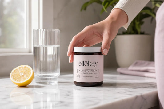 Woman learning how to read supplement labels with Ellekay Morning Skinny bottle on a bright kitchen counter