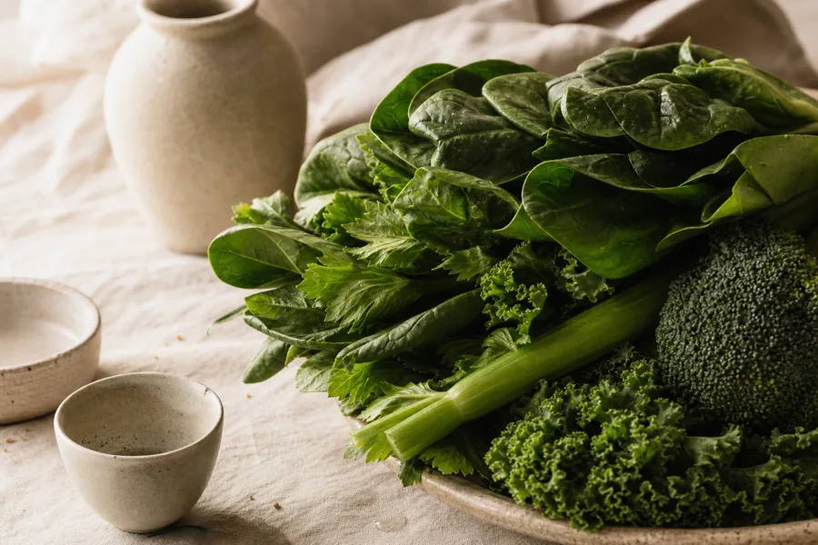 Leafy greens, a broccoli floret and celery stalks, the plant fiber cellulase and hemicellulase help break down